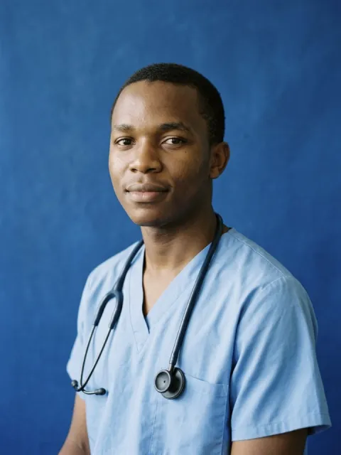 Medical student in scrubs with a stethoscope